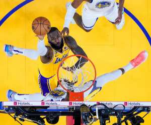 Los Angeles Lakers forward LeBron James, middle, shoots against Golden State Warriors forward Draymond Green during the first half of Game 5 of an NBA basketball second-round playoff series Wednesday, May 10, 2023, in San Francisco.